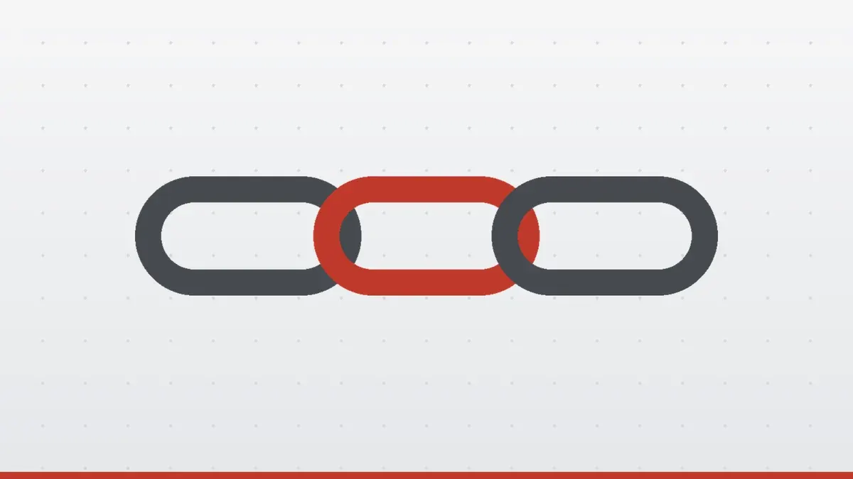 Three linked chain rings, the middle one red