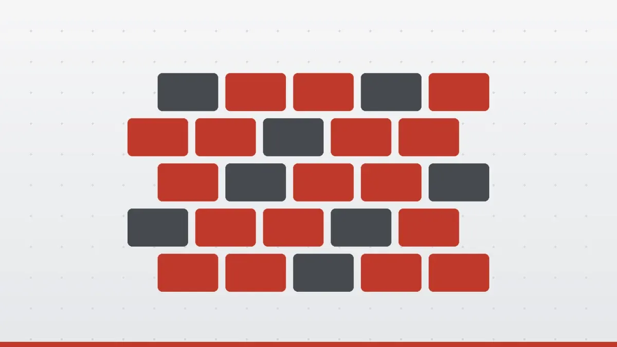 A red and grey brick wall